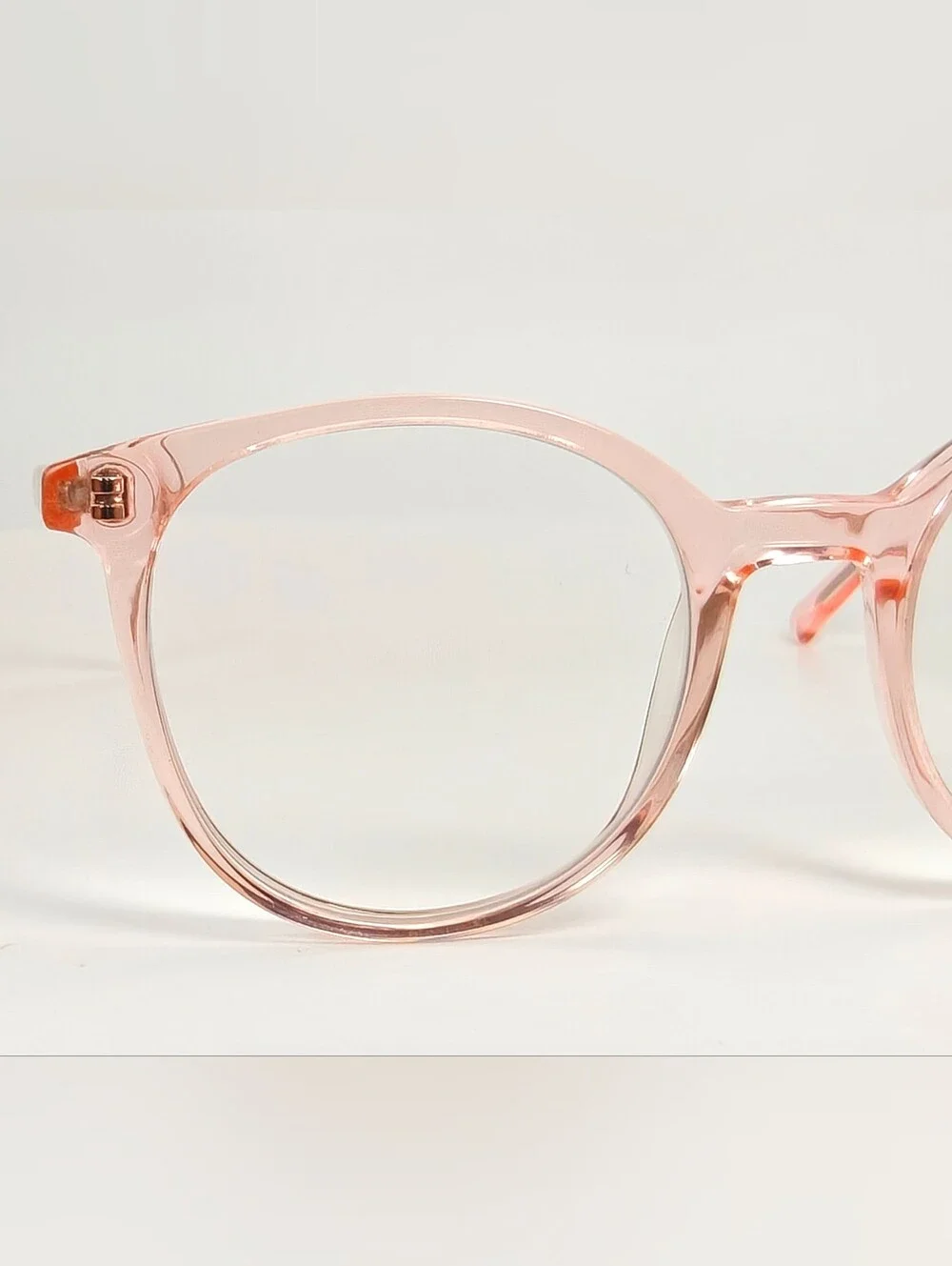 Noun. Transparent Pink Round Women's Eyeglasses. Minimalist..